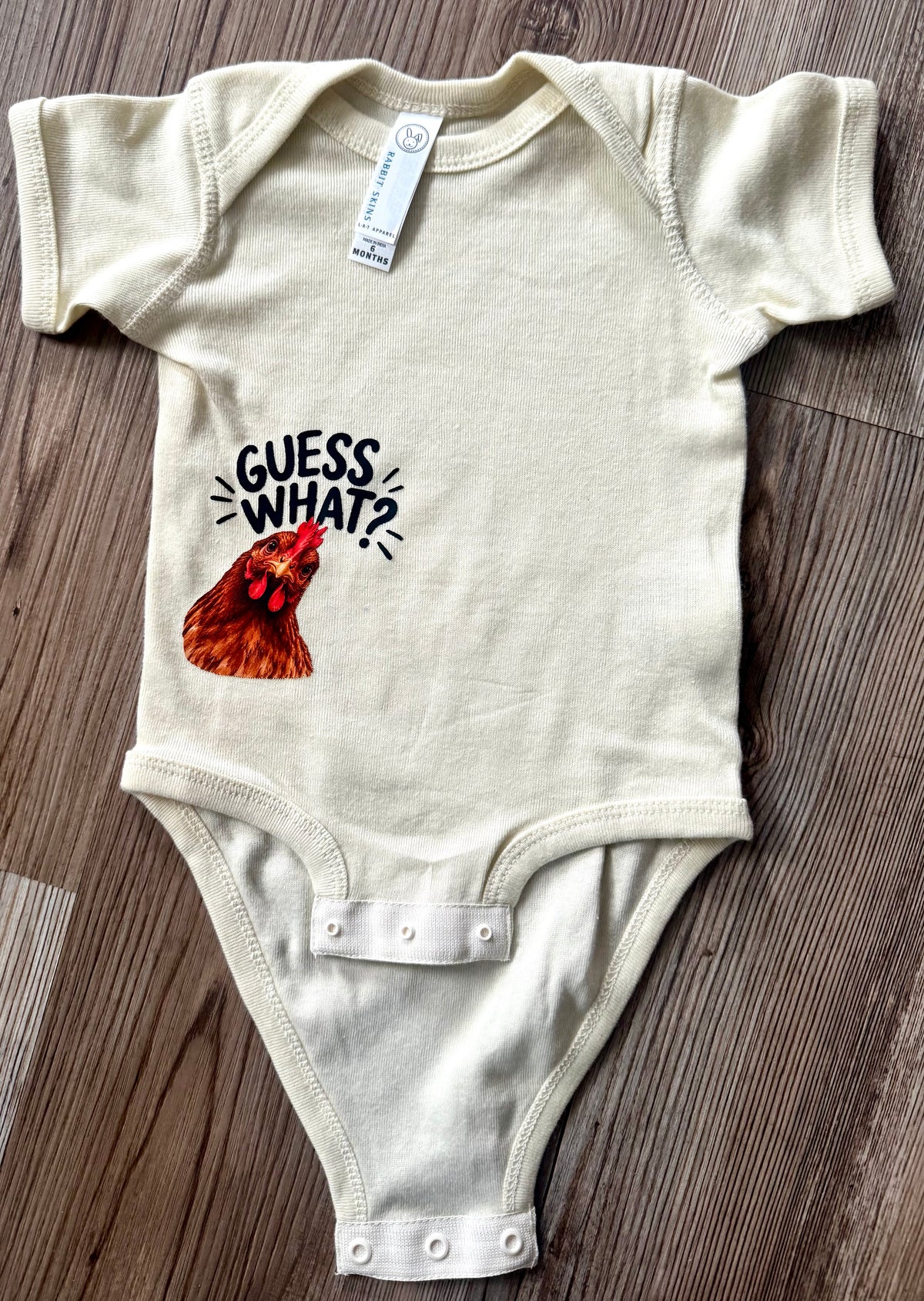 Guess what Infant Onesie